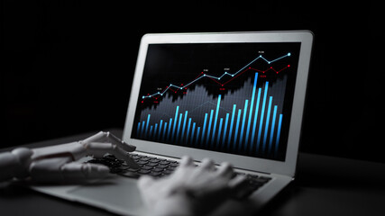 A robotic hand engages with a sleek laptop showcasing an impressive financial data visualization,...