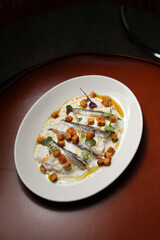 Gourmet Anchovy Appetizer with Cream Sauce and Croutons