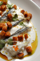 Gourmet Anchovy Appetizer with Cream Sauce and Croutons