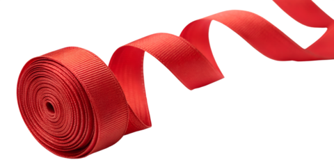Bright red textured ribbon unrolling from a spool in a dynamic spiral shape isolated on transparent background
