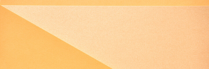Abstract geometric composition with light and dark orange curves and angles on textured paper background.