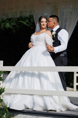 Couple celebrates joyful moment during wedding ceremony in beautiful outdoor setting