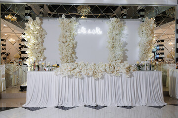 Elegant floral decor at a wedding reception in a classy banquet hall setting