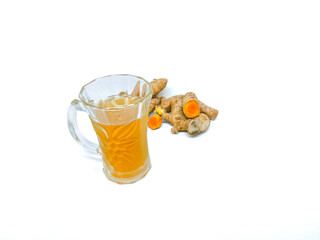 Refreshing Turmeric Drink in a Glass with Fresh Herbal Roots on White Background