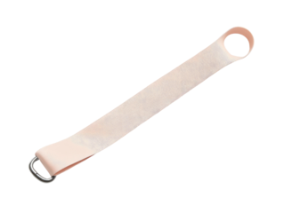 Peach-colored fabric strap with two metal rings against dark background