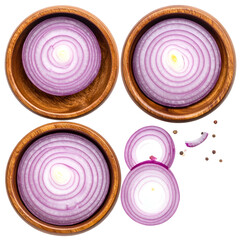 Overhead view of four wooden bowls holding red onion slices, some loose, on black