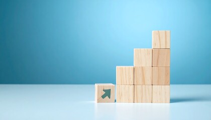 A conceptual image of wooden blocks arranged to form a staircase, symbolizing growth and progress against a solid blue backdrop