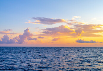 Sunset with sea. Colorful majestic scenery sunset sky with amazing clouds and waves. Beautiful sunset over sea landscape
