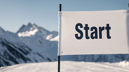 Starting line sign amidst snowy mountains. Get ready to conquer the slopes and begin the adventure ahead! Time to make progress and start the challenge.