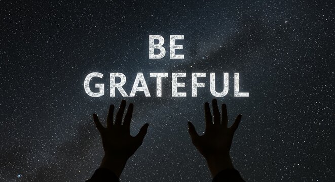 Be Grateful: Motivational Message Against a Dramatic Starry Sky with Outstretched Hands