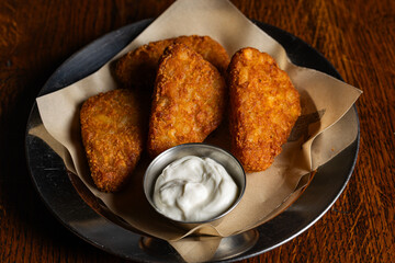 Crispy Fried Cheese Sticks or Hash Browns with White Dipping Sauce