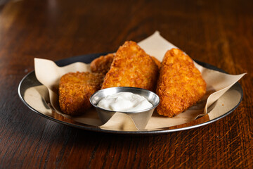 Crispy Fried Cheese Sticks or Hash Browns with White Dipping Sauce