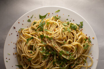 Italian pasta in a white plate close up. Traditional Mediterranean cuisine and homemade culinary recipes.