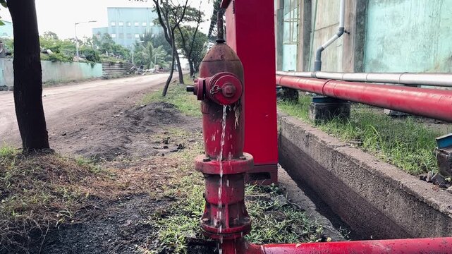Leaking Fire Hydrant in Industrial Area: Water Waste and Infrastructure Issues