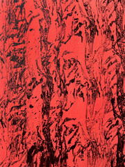 Abstract red and black textured wall background with rough brush strokes and paint splashes. Artistic grunge pattern, expressive modern surface design for creative projects.