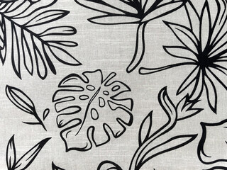 Black and white tropical leaf pattern on fabric. Monochrome botanical design with hand-drawn palm, monstera and exotic foliage. Seamless nature background perfect for textiles, wallpapers, and surface