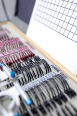 Close-up of a trial lens set used for eye exams in optometry, showing various corrective lenses in...