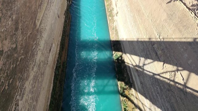 Aerial view of boats navigating through the narrow Corinth Canal in Greece.