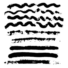 Set of hand-drawn grunge brush strokes and wavy ink lines with rough texture on a white background.