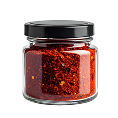 A clear glass jar with a black lid, filled with vibrant red crushed chili flakes