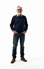 Fototapeta premium Mature Caucasian man with gray hair and beard smiles confidently. He wears glasses, a dark blue sweater, jeans, and brown shoes. Standing with hands in pockets against a white background.