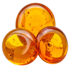Three translucent amber spheres with internal specks, clustered against a black backdrop