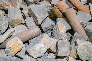 Ground-level shot of scattered concrete and metal debris, daytime lighting, candid documentary style