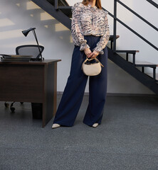 Stylish women's clothing. Looks spectacular on a girl. Casual clothes, street fashion, fashion accessories, style, elegance, beautiful clothes. Summer, spring or fall street look.