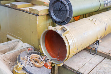Military scene on aircraft carrier deck featuring large caliber cannon barrels, metal parts, and...