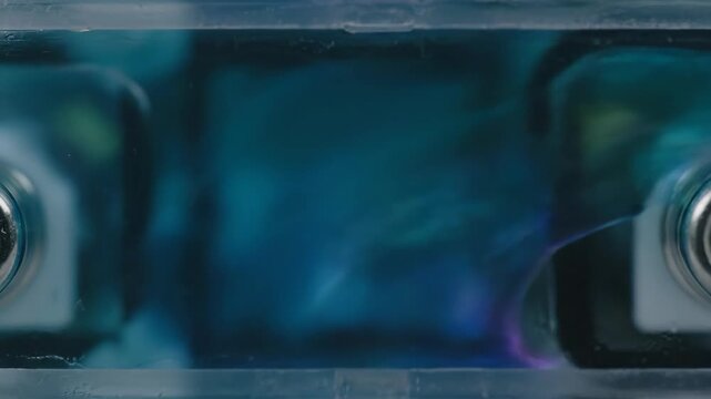 Battery compartment detail inside electronic device, grey tone.