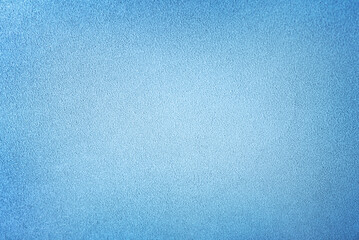 Background of light blue suede matte fabric closeup. Velvet matt texture of sky nubuck textile.