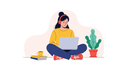 A person working on a laptop while wearing headphones and sitting next to a plant.