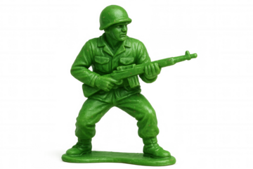 Green plastic toy soldier figurine holding a rifle, representing childhood, war games, training, and military play