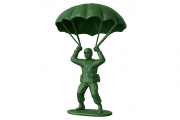 Green plastic army man toy paratrooper with parachute falling, vintage military figurine landing