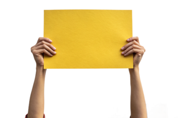 se-up of a hand holding up yellow paper. Cutout. Transparent. Message. Protest. Demonstration. Opinion. Statement.