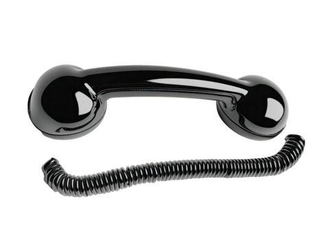 Glossy black vintage telephone receiver and coiled cord on dark background