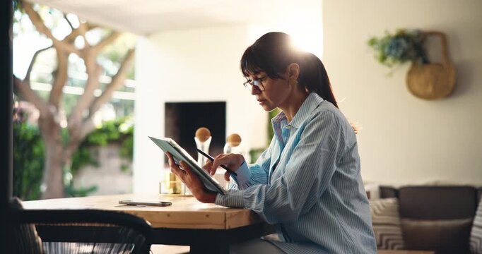 Tablet, remote work and woman in home office for research, copywriting or editing. Pen, technology and mature freelancer in house to scroll newsletter, review blog and reading info online with flare