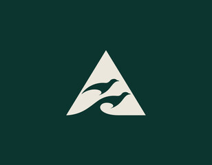 Fototapeta premium A sophisticated logo featuring a triangle with two birds and wave elements, symbolizing harmony and nature. Ideal for brands focused on environmental or oceanic themes.