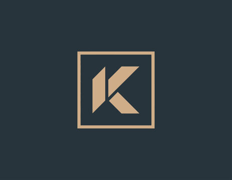 This image showcases a stylish and geometric representation of the letter K, enclosed within a sophisticated gold frame that conveys luxury and elegance.