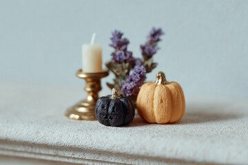 Decorative Pumpkins with Candle and Lavender Flowers on Fabric