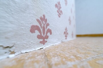Close-Up of Vintage Floral Wallpaper Texture in a Room Corner