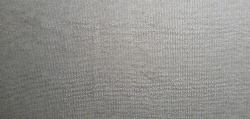 Fototapeta premium Neutral grey textured fabric background. Woven natural linen or hemp material surface for design projects. Subtle pattern, plain weave, detailed textile detail.