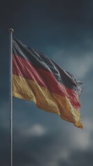 German flag waving against a dramatic sky with clouds showcasing national pride and symbolism - Low Contrast