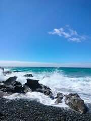 Waves crashing against the rocks at Playa de Garcey, Fuerteventura. A wild and remote beach showcasing the island’s rugged volcanic coastline.