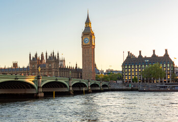 Naklejka premium Houses of Parliament with Big Ben tower and Westminster bridge at sunset, London, UK
