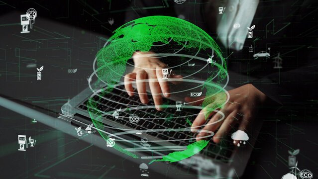 A visual representation of hands typing on a laptop surrounded by a digital globe and eco-friendly icons, symbolizing the importance of technology in promoting sustainability. Xenic - Powered by Adobe
