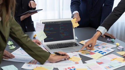 Analyst team use sticky note for creative and analytic brainstorm for business idea with BI data dashboard on laptop screen. Analysis financial data visualization tech for marketing strategy. Prodigy