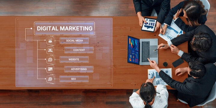 A diverse business team collaborates on digital marketing strategies while utilizing laptops and visual aids to enhance online effectiveness and growth initiatives. Trope