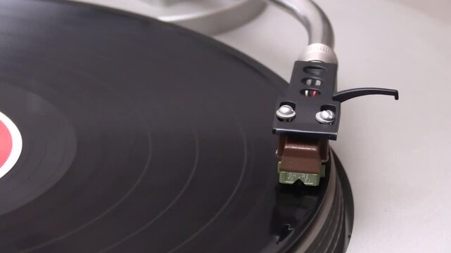 Turntable and cartridge from 1981. Vinyl record.