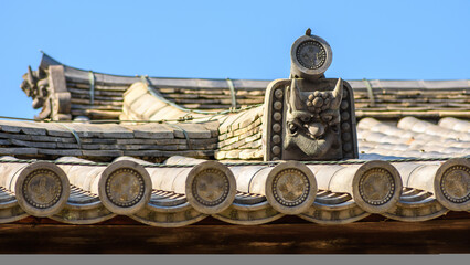 Traditional Japanese roof with ornate tiles and decorative elements in Nara, Japan